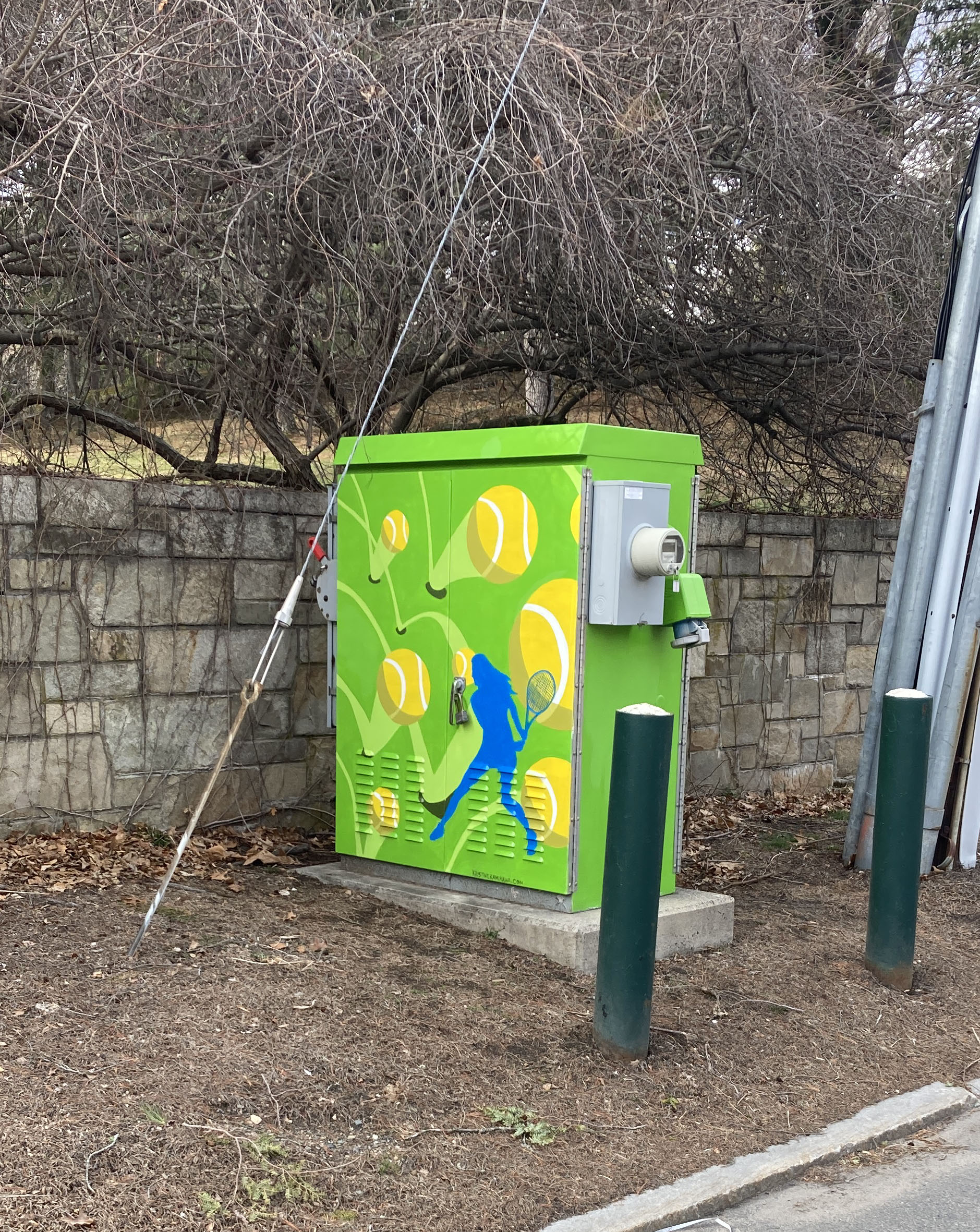 Woman tennis player on utility box