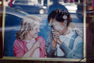 Two girls laughing together
