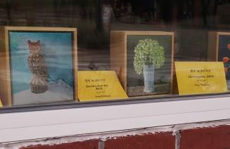 Art in August artworks in shop window