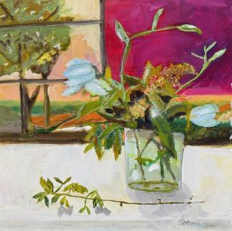 Flowers on a table near a window